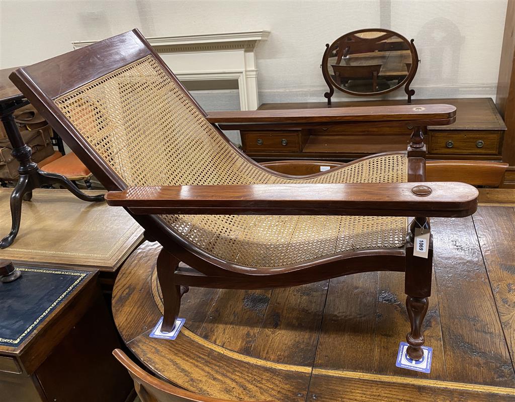 A caned hardwood plantation chair, width 70cm, depth 110cm, height 89cm